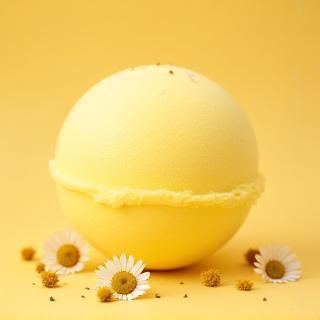 Large yellow bath bomb with chamomile flowers